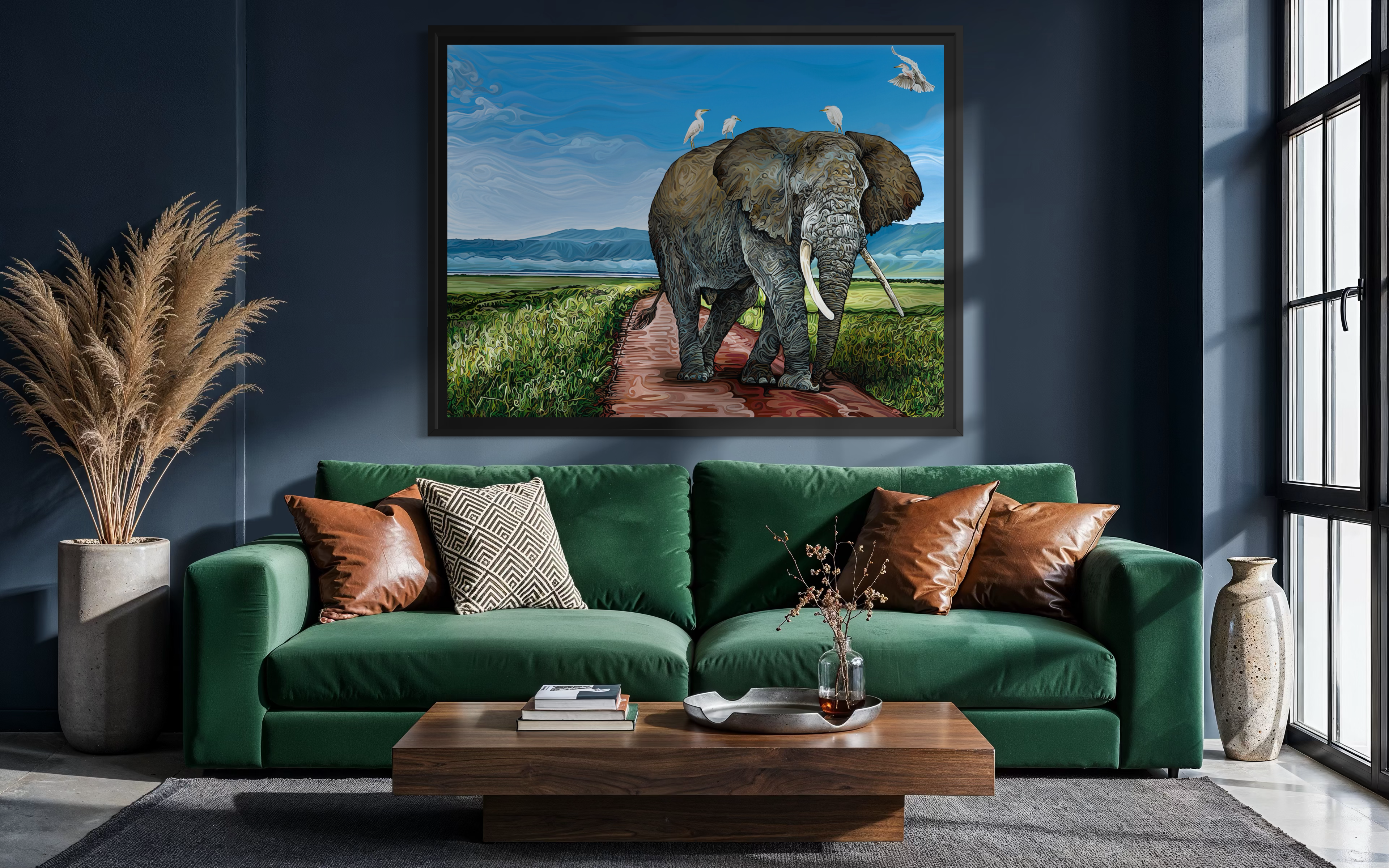 A wildlife painting titled Ngorongoro: Where Giants Walk depicts an elephant on a grassy path with birds riding its back.