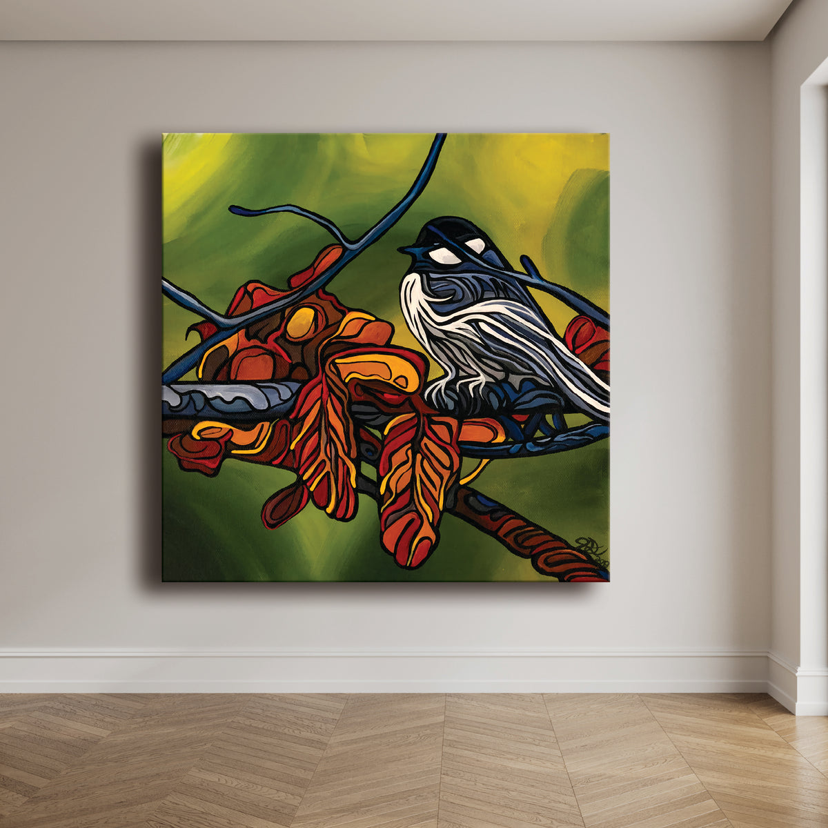 A square canvas wall art print by Jeff Dillon Fine Art depicting a black and white bird perched on a branch with red and orange leaves, set against a green and yellow background, displayed on a beige wall above a light wood herringbone floor.