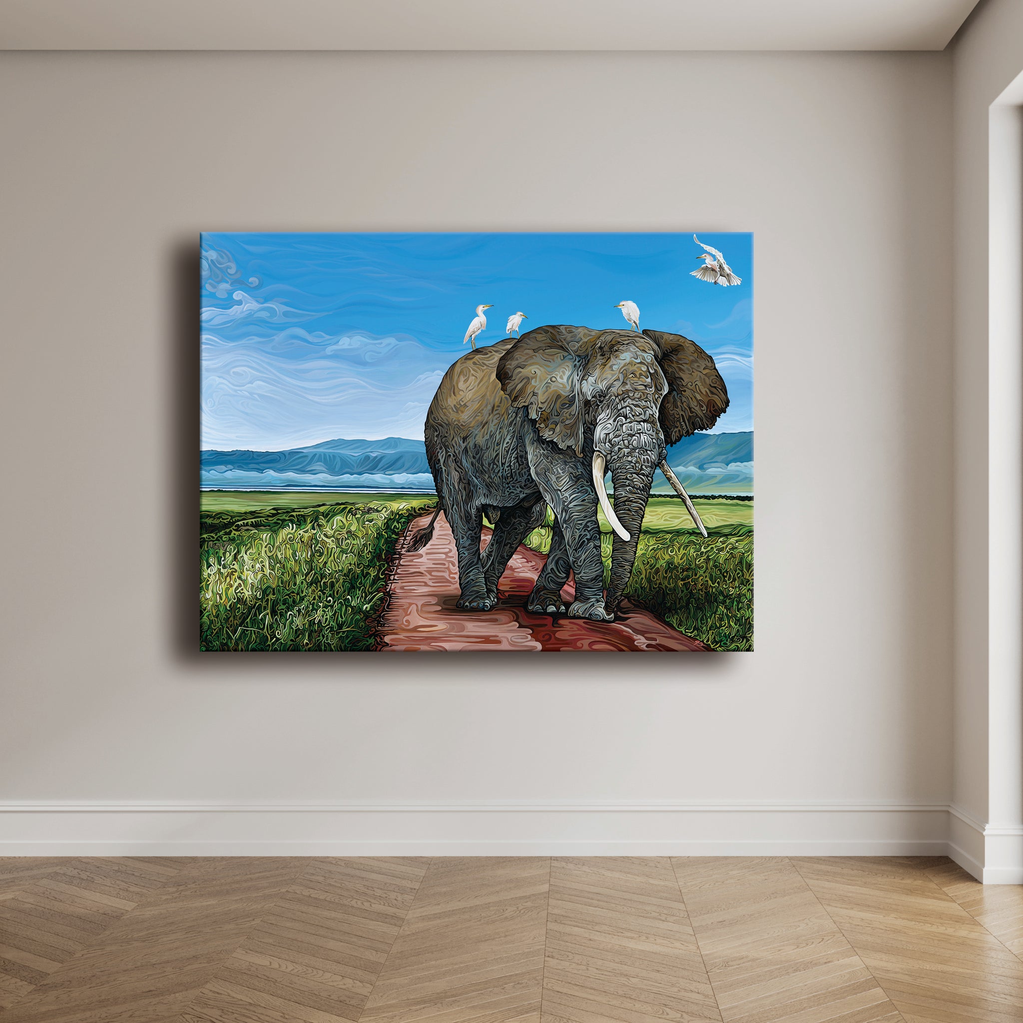 A wildlife painting titled Ngorongoro: Where Giants Walk depicts an elephant on a grassy path with birds riding its back.