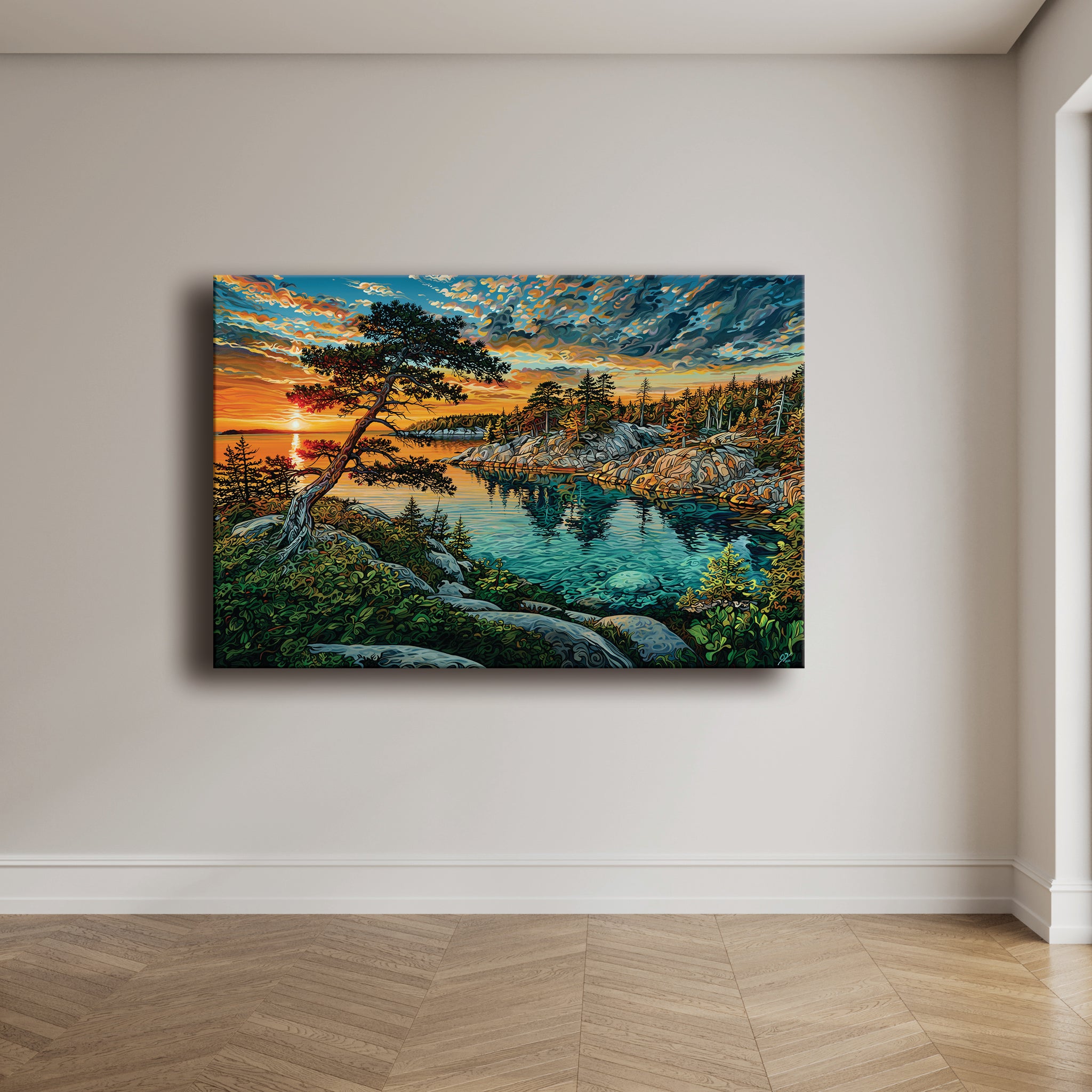A rectangular canvas wall art print depicting a scenic lake landscape at sunset, hung on a light beige wall above a wood floor.