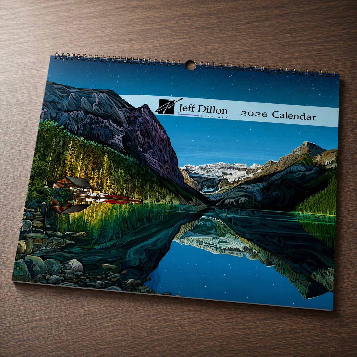 A calendar with a cover illustration of a lake and mountains.