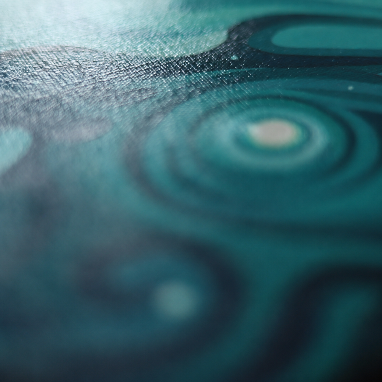 Close-up detail of a Jeff Dillon painting showing teal colour, canvas texture, flowing dark linework, and abstract movement.