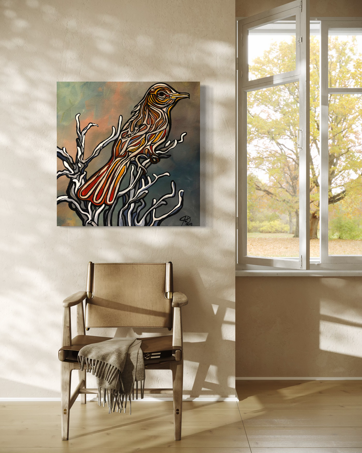 A square canvas art print Jeff Dillon FIne Art featuring a stylized bird perched on branches, displayed on a beige wall in a modern room setting with a wooden chair and a window showing outdoor foliage.