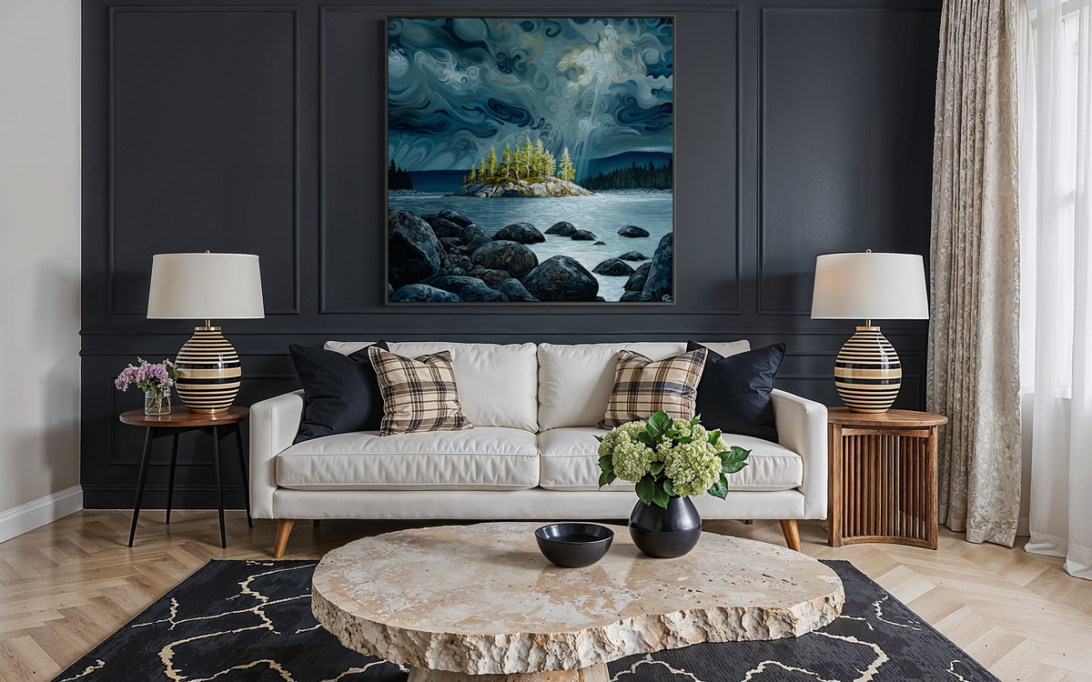 A large vertical landscape painting of a rocky island under a stormy sky, displayed on a dark paneled wall above a white sofa in a modern living room setting.