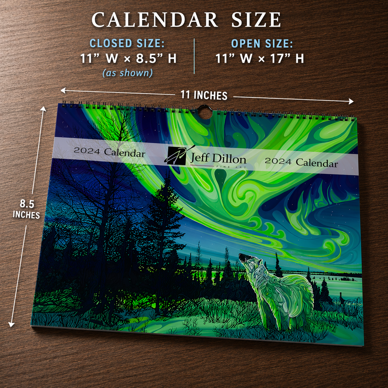 A wolf beneath vibrant northern lights, artwork by Jeff Dillon Fine Art, featured on a wall calendar.