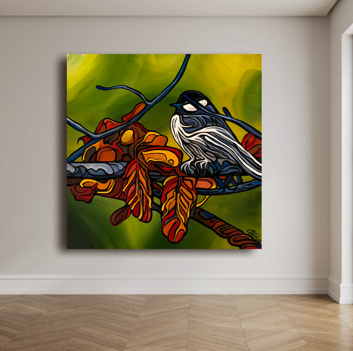 A square canvas wall art print Jeff Dillon FIne Art depicting a black-and-white bird perched on a branch with orange and red leaves against a yellow-green background, displayed on a beige wall above a wood floor.